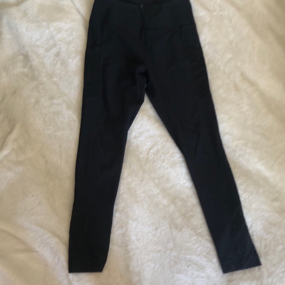 Black yoga pants with mesh pockets.